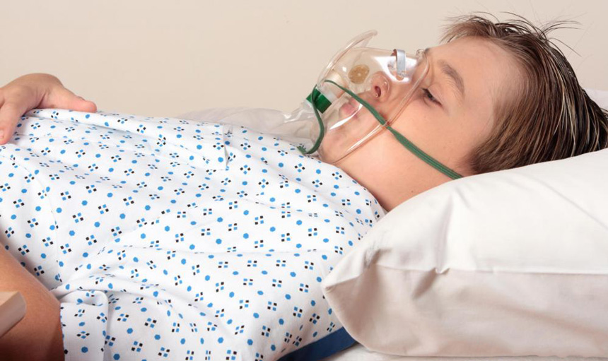 child-in-gown-with-oxygen-mask.jpg